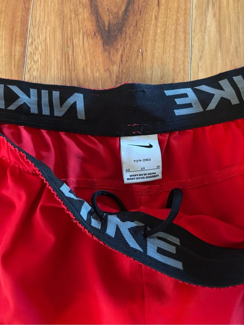 c-1 Nike Men’s Bright Red Athletic Shorts with White Swoosh.